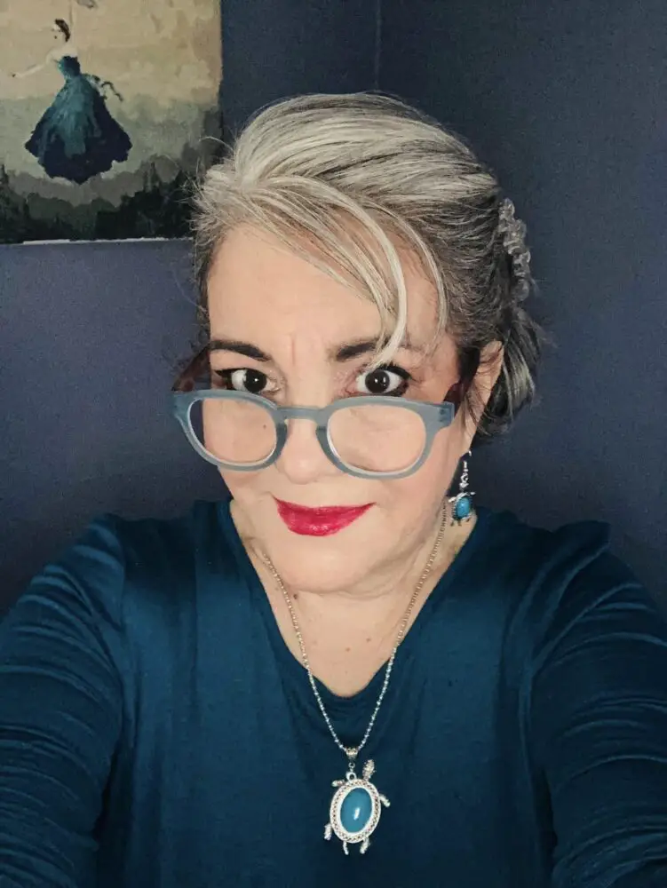 blue glasses gray hair with bangs